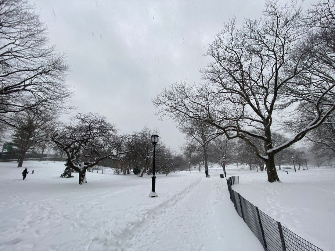 the snowy grounds of Riverside Park, with bare trees